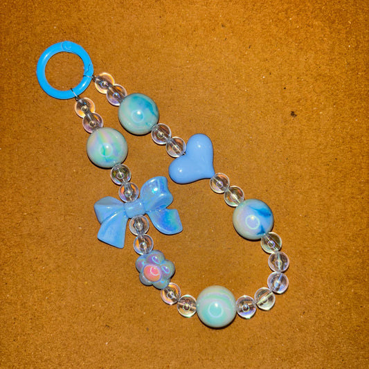 Bracelet with blue and clear beads on a brown background