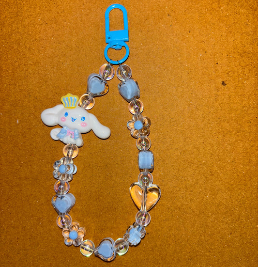 Beaded bracelet with a bunny charm on a brown background