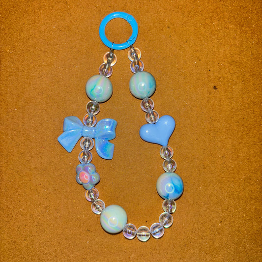 Bracelet with blue and clear beads on a brown background