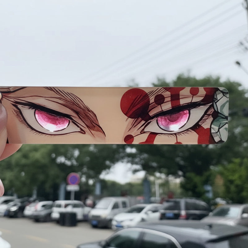 Anime-style character with red eyes held up to the camera against a blurred outdoor background